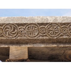 Different solar discs and solar crosses on pillar stone